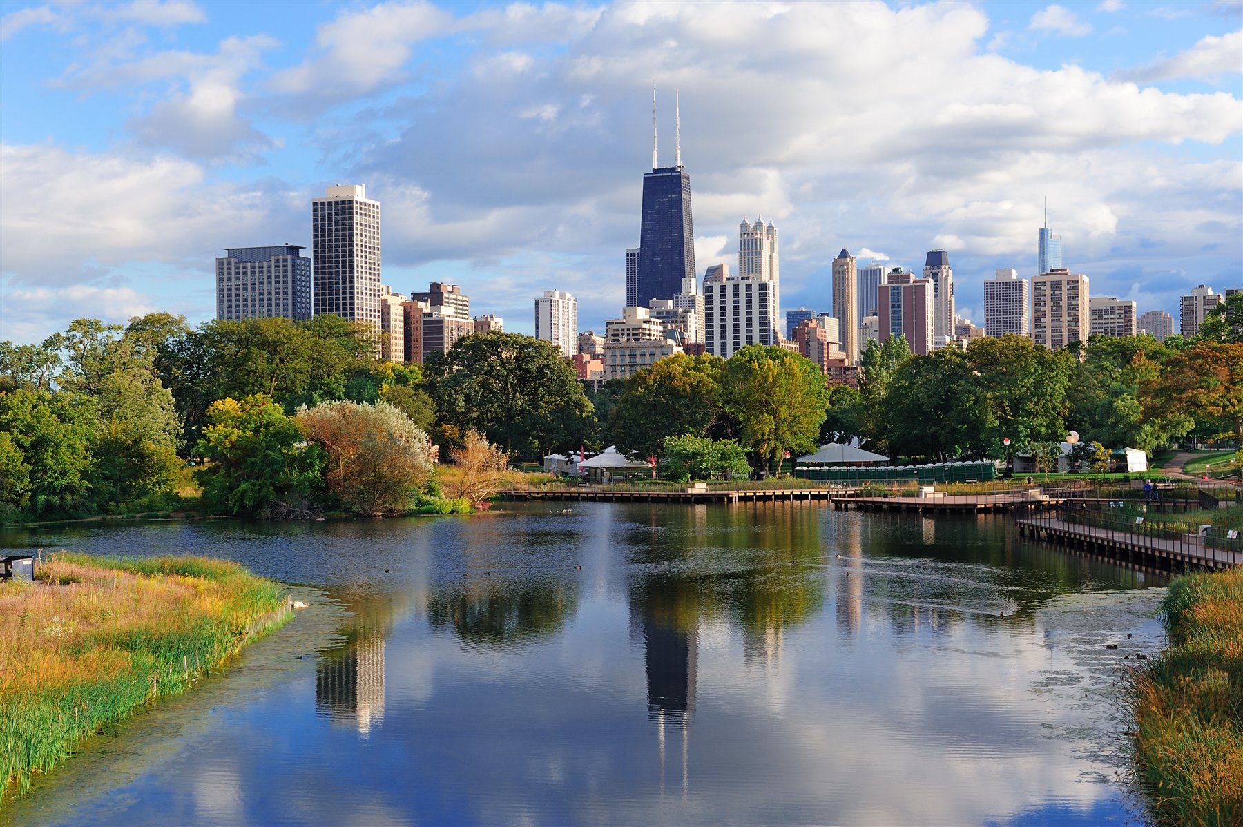 Lincoln Park and the Chicago skyline viewed across a neighborhood pond
